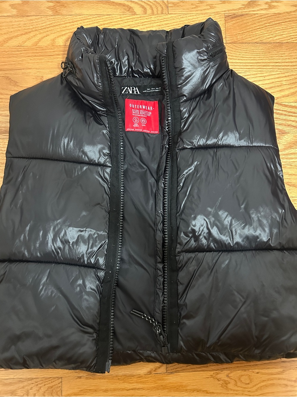 Zara black shiny puffer vest with hidden hood